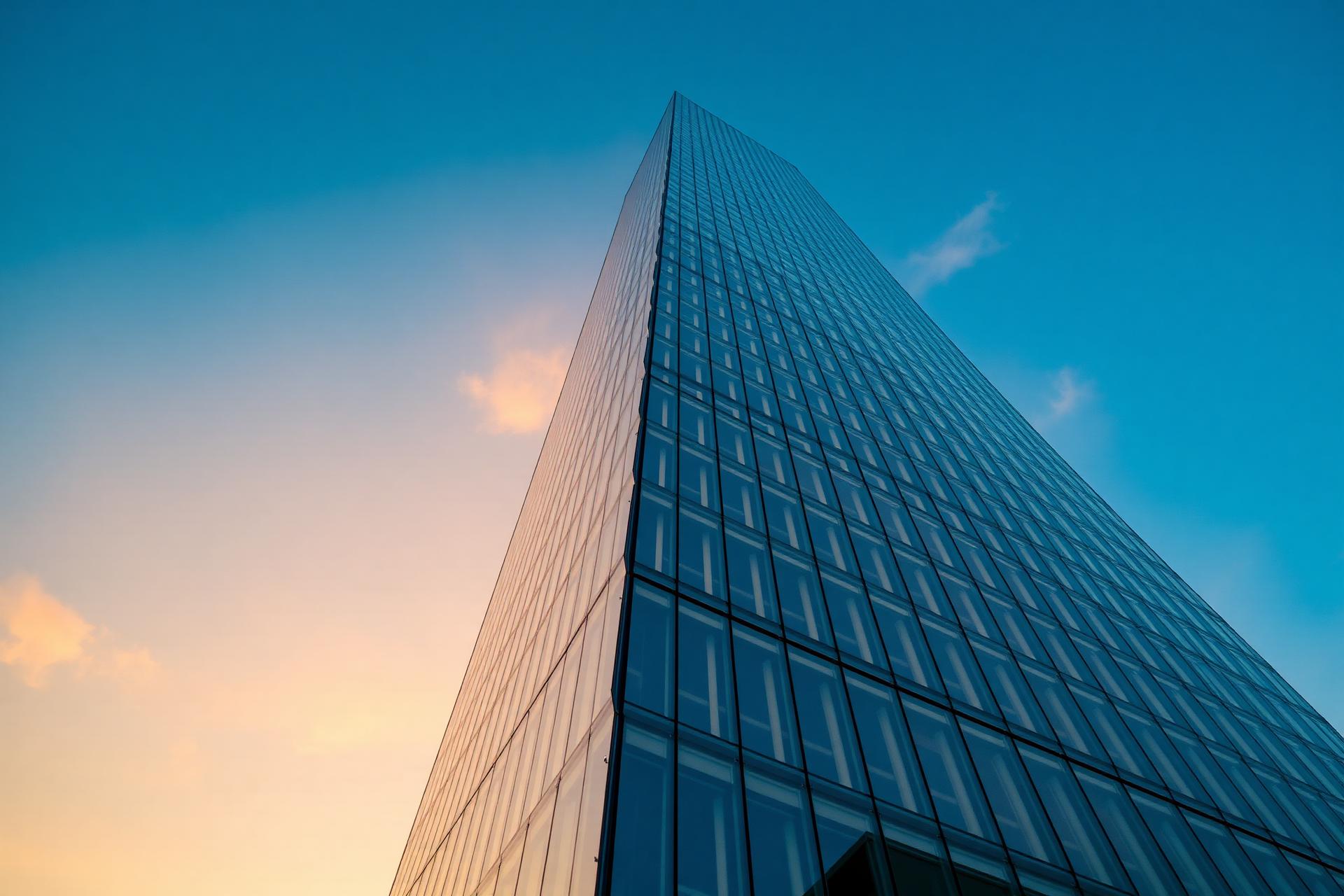 Modern glass skyscraper at golden hour